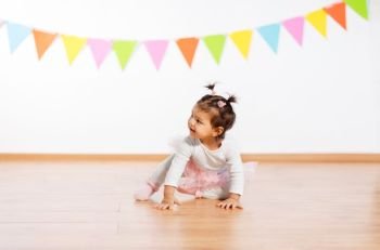 childhood, people and celebration concept - happy baby girl on birthday party. happy baby girl on birthday party. happy baby girl on birthday party