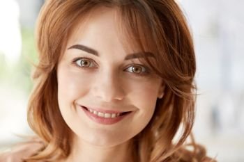 people, emotion and facial expression concept - portrait of happy smiling young woman. portrait of happy smiling young woman. portrait of happy smiling young woman