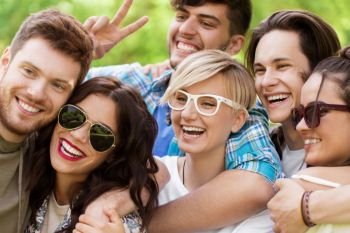 friendship, leisure and summer concept - group of happy smiling friends outdoors. group of happy smiling friends outdoors. group of happy smiling friends outdoors