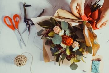 Close up bouquet preparation. Small business concept. Floral bouquet preparation