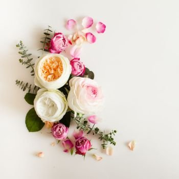 Floral round wedding frame flat lay. Rose flowers top view with copy space. Floral wedding frame 