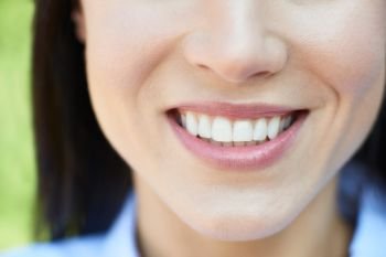 Close Up Of Woman With Beautiful And Perfect Teeth