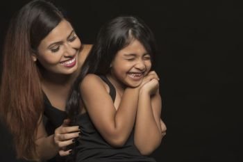 Portrait of happy mother and daughter