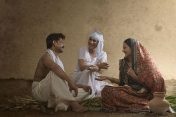Rural Indian family sitting together and talking