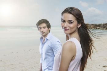 Portrait of young couple on beach