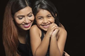 Portrait of smiling mother and daughter