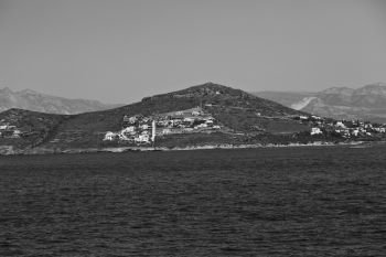 sailing in europe greece santorini island hill  and rocks on the summertime beach 
