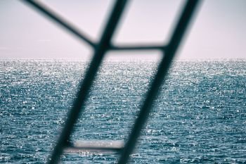 in australia the bokeh of light from the railings  boat and ocean