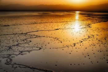 in  danakil ethiopia africa  in the  salt lake  the sunset  reflex  and landscape