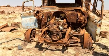 in  danakil ethiopia africa  in the  old italian village  rusty antique car and hot