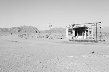 in iran old gas station  the desert mountain background and nobody