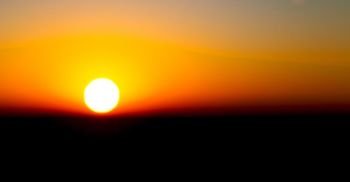  the blurred  sun falling down arabian mountain  in   oman  