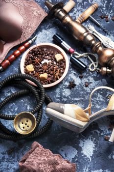 sexy lingerie, hookah and coffee. erotic concept with women’s underwear, hookah and coffee
