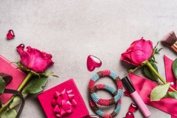 Pink Women accessories for Valentines Day or Dating: bunch of roses,hearts, gifts,make up, crown,bracelets.  Top view, border
