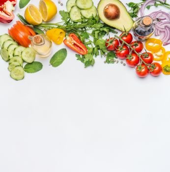 Healthy clean eating layout, vegetarian food and diet nutrition concept. Various fresh vegetables ingredients for salad on white table background, top view, border