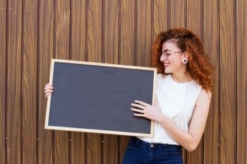 Young woman teach with a blackboard 
