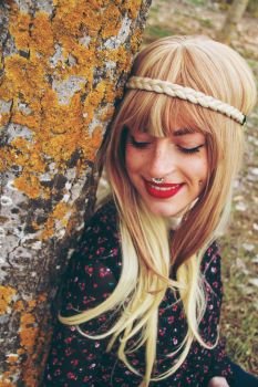 Happy hippie young woman in an autumn day 