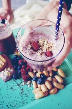 Healthy breakfast with smoothie, fruits and grains 