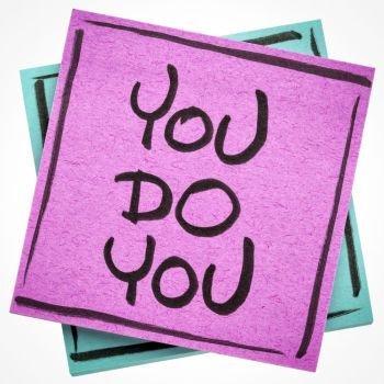 you do you, being yourself concept - handwriting on a sticky note isolated on white