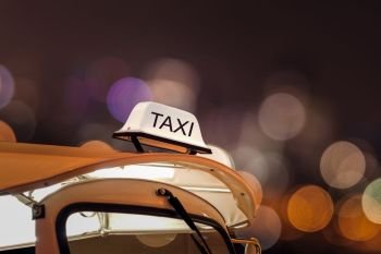 Taxi car on street and bokeh at night life