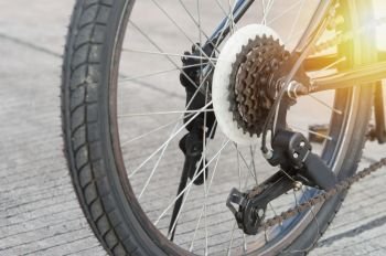 Close up of a Bicycle wheel with details, chain and gearshift mechanism