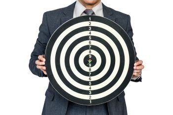 businessman hold dartboard with arrow hitting the target isolate on white background