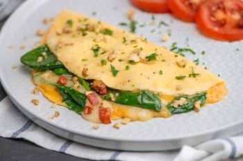Omelet with vegetables on a plate.