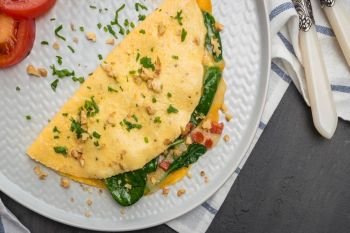 Omelet with vegetables on a plate.