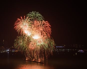 Colorful firework on the sky at Pattaya coast with cityscape background, Thailand