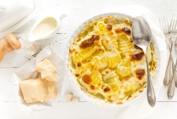 Baked potato gratin with garlic, cream and parmesan cheese