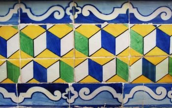 Blue, yellow and green Portuguese tiles (azulejos) with geometric pattern