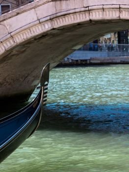 Old Marble Bridge and Close up of Gondola’s Iron Prow in Venice