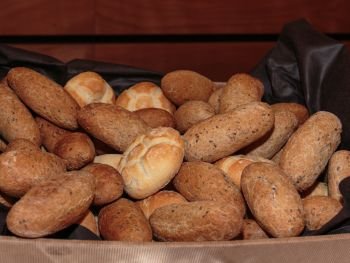 Roll Bread Heap and Wholemeal Rolls inside Box