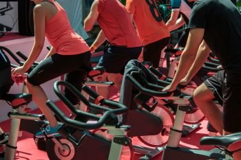 Group of Boys and Girls at Gym: Workout with Spinning Bikes