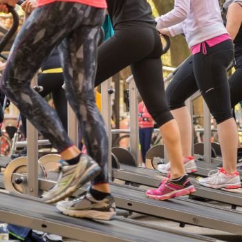 Women in Sportswear Exercising Outdoor on Treadmills