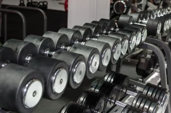 Black and Steel Dumbbells in Gym: Weight Fitness Equipment.. Black and Steel Dumbbells in Gym: Weight Fitness Equipment