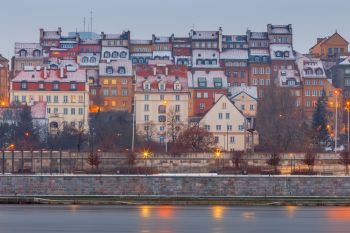 Warsaw. View of the old city at sunset.. View of the old town, Vistula river and the city embankment at sunset. Warsaw. Poland.