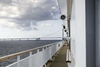cruise ship crossing the great belt bridge at denmark at the danish islands