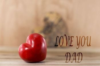 Happy fathers day red heart shape with text love you dad. fathers day love you dad