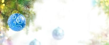 Christmas Background of Blue Balls on the Christmas Tree at the Defocused Lights Background with Copy Space