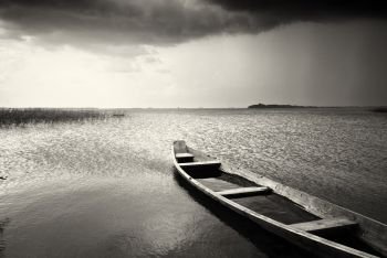 Lonely boat on lake. Composition of nature.. Lonely boat on lake