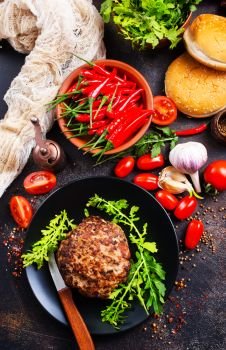 ingredients for burgers. Products for preparation of burgers: buns, tomatoes, sauce, cutlets