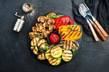 Grilled vegetables. Grilled vegetables with sauce, grilled vegetables on black board