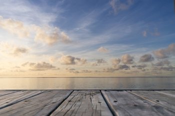 Wooden floor with seascape and sky background