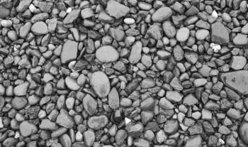 Wet pebble, rocks background. Stone texture. Wet pebble, rocks background