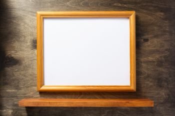picture frame at wooden background. photo picture frame at wooden background