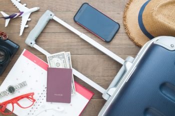 Luggage suitcase, passport, money and mobile phone, Go on board, Travel holiday concept, Flat lay