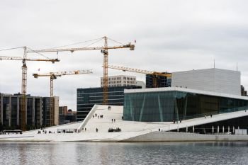 Industrial cranes near Oslo opera background. Industrial cranes near Oslo opera background hd