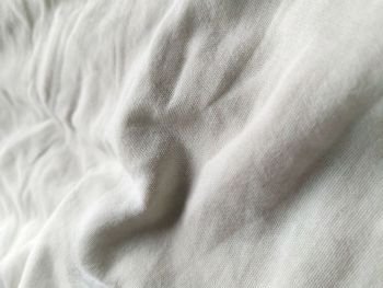 White crumpled bedsheet background . White crumpled bedsheet background  hd