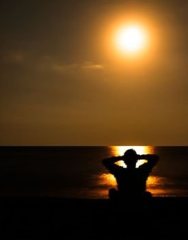 Vertical vivid lonely man staring golden sunset horizon ocean background backdrop. Vertical vivid lonely man staring golden sunset horizon ocean ba